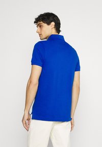 Tommy Hilfiger SLIM - Polo - bio blue