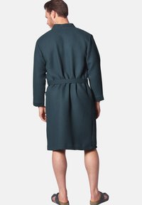 Waffle-textured, dark teal robe with a front tie, long sleeves, and a relaxed fit, shown from the back.