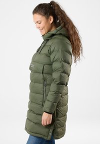 Olive green puffer coat with a hood, zippered side pocket, elastic drawstrings, and a knee-length cut. Features a quilted design.