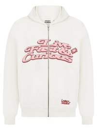 White zip-up hoodie with a large pink "Live Fast & Curious" graphic on the front, featuring a kangaroo pocket and ribbed cuffs.