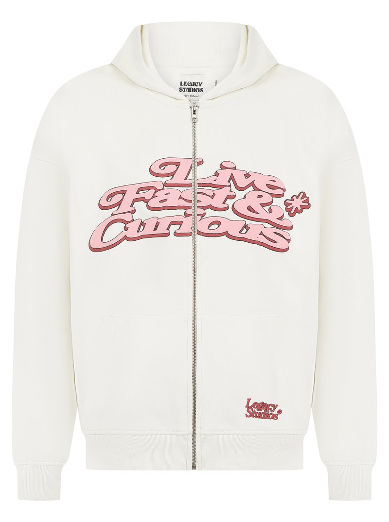 White zip-up hoodie with a large pink "Live Fast & Curious" graphic on the front, featuring a kangaroo pocket and ribbed cuffs.