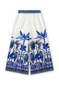 White wide-leg pants featuring a blue tropical bird and palm tree print, with a decorative waistband and intricate detailing at the hem.