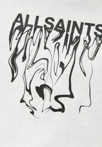 Biała koszulka z tkaniny z czarną abstrakcyjną grafiką liniową oraz napisem "ALLSAINTS" w pogrubionych, dużych literach. Miękka faktura z płynnym wzornictwem.