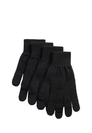 Quatre paires de gants en tricot noir empilées avec des poignets côtelés sur un fond blanc.