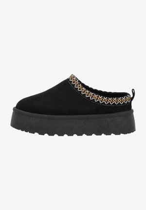 Black suede clog with a thick black rubber sole, accented by a decorative woven trim in white and gold along the collar.