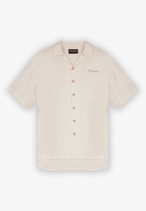 Short-sleeve, light beige button-up shirt with a collar, five front buttons, and subtle branding on the chest. Smooth fabric texture.