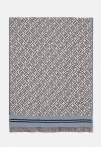 Geweven plaid in crème en grijs met een geometrisch patroon, voorzien van een blauwe accent en zwarte strepen aan de zoom, afgewerkt met franjes.