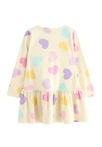 Langærmet kjole i blødt gult stof med pastel hjerte mønstre i pink, lilla, blå og gul; flæse i kanten ved taljen.