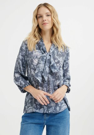 Bluse mit Blumenmuster in Marineblau und Hellblau, mit einer Schleifen-Halslinie, langen Ärmeln mit elastischen Bündchen und einem lockeren Schnitt.