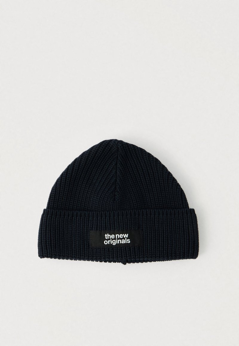 Black ribbed knit beanie with a folded cuff featuring a black patch labeled "the new originals" in white text.