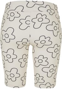 White bike shorts with a black flower pattern, featuring a high waistband and smooth texture, designed for comfort and style.