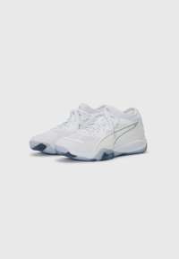 White athletic shoes with mesh panels, rounded toe, padded collar, and a translucent blue rubber outsole. Simple design with laces.