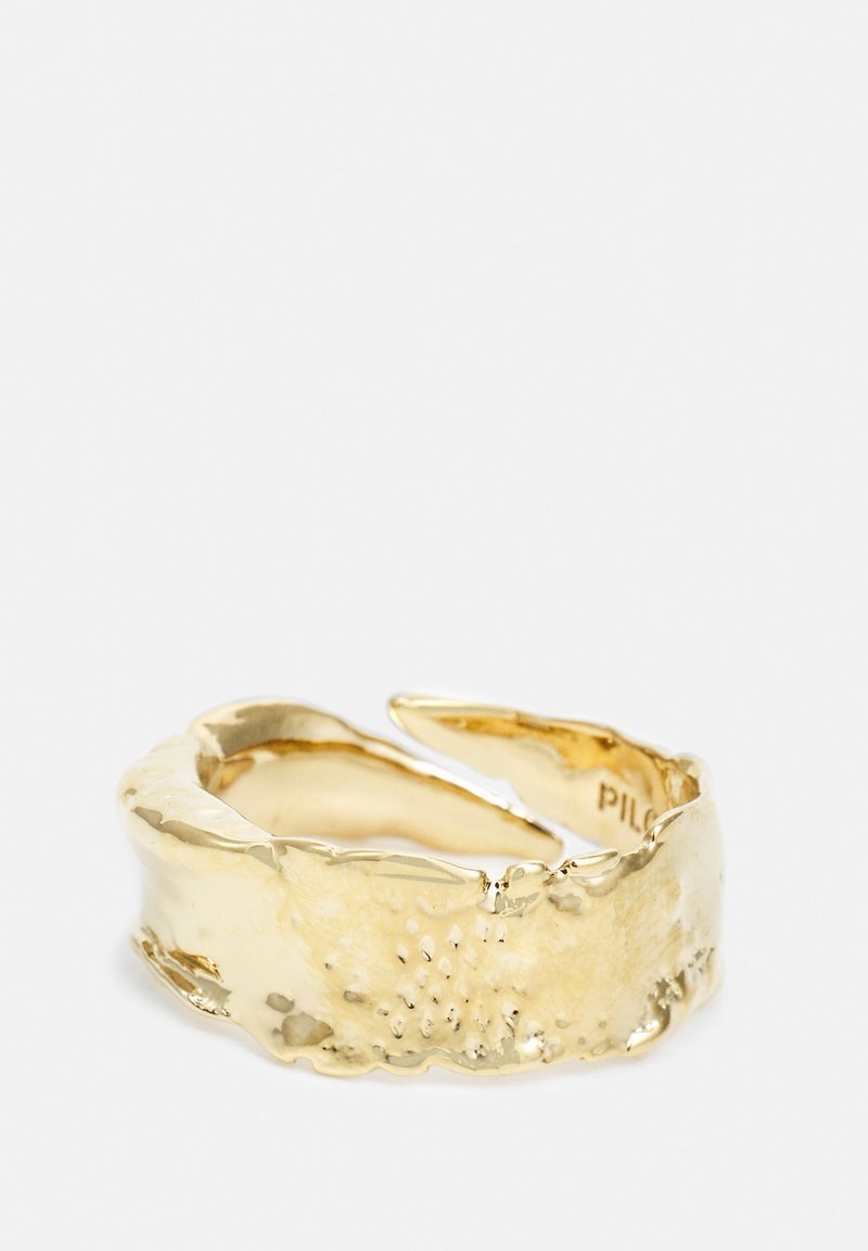Gold ring featuring a textured, wavy design with a polished finish, showing intricate detailing and a gap in the band for adjustable fit.