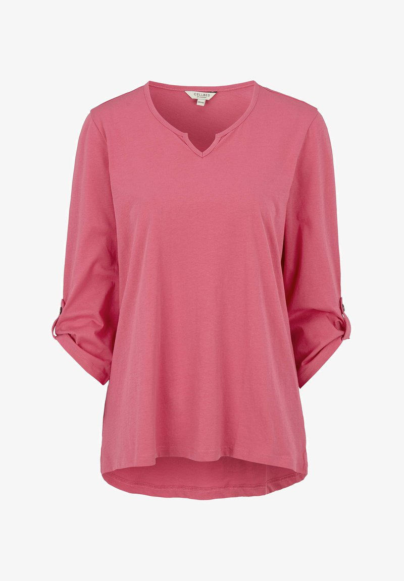 Roze, langarm shirt van zachte stof met een V-hals en opgerolde mouwen die met knopen zijn vastgezet. Heeft een gebogen zoom voor een ontspannen pasvorm.