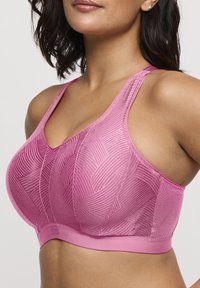 Reggiseno sportivo rosa realizzato in tessuto strutturato, con motivo geometrico, spalline larghe e design senza cuciture, di supporto.