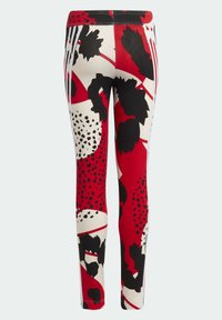 Leggings med en tætsiddende design, prydet med et dristigt blomstermønster i rød, sort og hvid, lavet af et strækbart materiale.