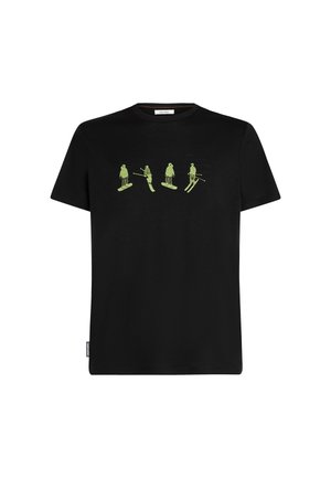 Zwarte katoenen t-shirt met vier groene grafische figuren in skieën en snowboarden poses. Korte mouwen en een ronde halsontwerp.