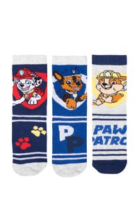 Tre paia di calzini di cotone con personaggi di cani dei cartoni animati. I colori includono blu navy, grigio e rosso con motivi giocosi e impronte di zampe.