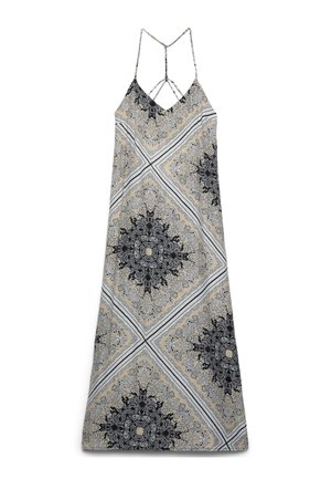 Robe maxi sans manches avec fines bretelles, avec des motifs symétriques paisley et floraux beige, noir et blanc en forme de losange.