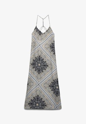 Robe maxi sans manches avec fines bretelles, avec des motifs symétriques paisley et floraux beige, noir et blanc en forme de losange.