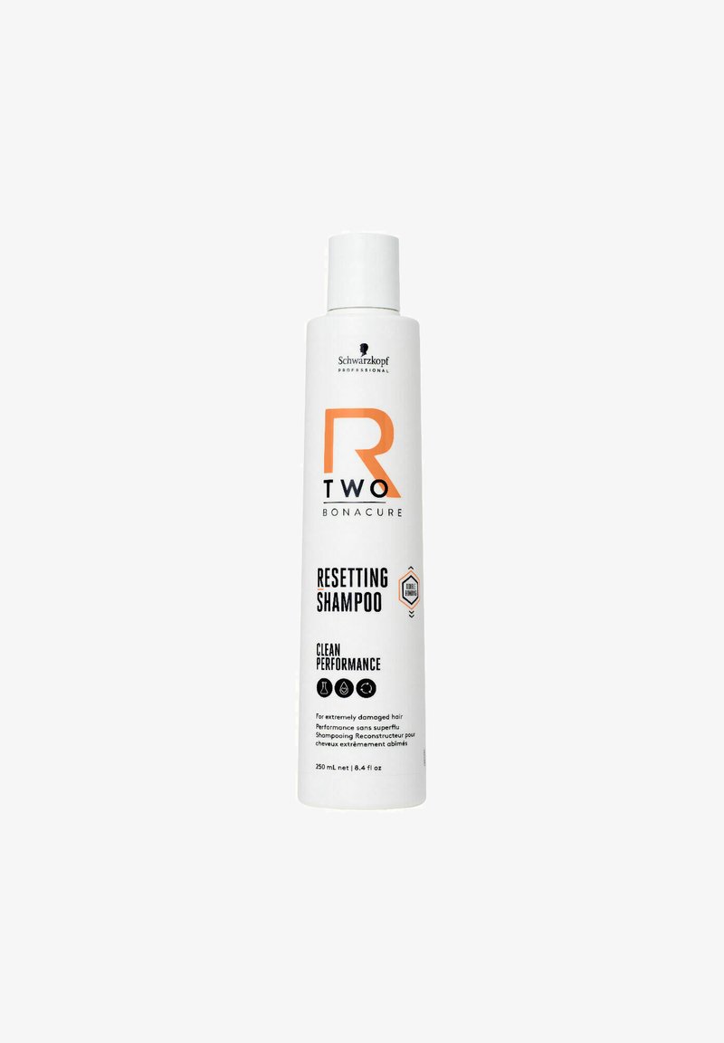 Witte fles van Schwarzkopf R2 Bonacure Resetting Shampoo, met een oranje logo en zwarte tekst, met een gladde matte afwerking. 250 mL.