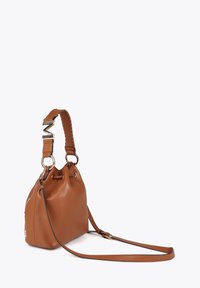 Brown leather bucket bag with a braided strap, gold hardware, and drawstring closure. Compact shape with a smooth texture and side pocket.