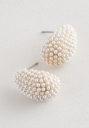 Gold-tone earrings featuring a textured design covered with small white pearls, shaped like puffy ovals, with metal posts for fastening.