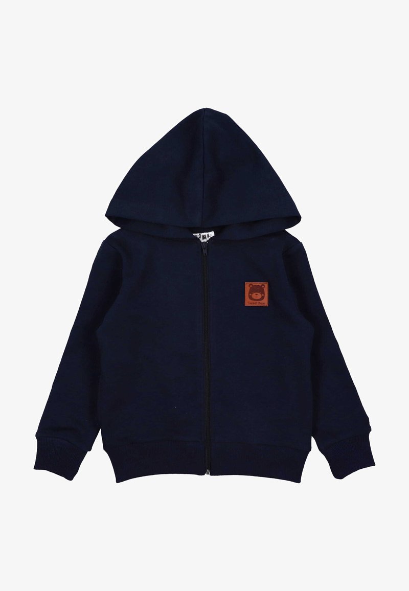 Felpa con zip navy e tasca a marsupio, realizzata con un tessuto morbido. Presenta una toppa in pelle marrone con un logo d'orso sul petto.