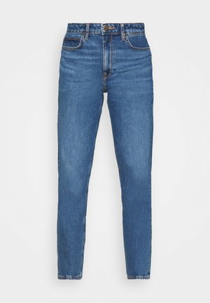 Jeans de mezclilla azul con un corte ajustado, que cuentan con una cintura alta, diseño de cinco bolsillos y un ligero desgaste en toda la tela. Acentos de costura clásica.