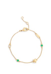 Gold chain bracelet featuring a star charm and two green stone accents, all on a delicate link chain with a lobster clasp closure.