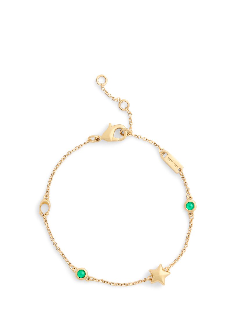 Gold chain bracelet featuring a star charm and two green stone accents, all on a delicate link chain with a lobster clasp closure.