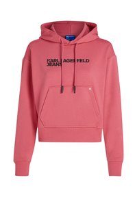 Rožinė vilnonė dėvima striukė su priekiu kišene, su "KARL LAGERFELD JEANS" juodu logotipu, pagaminta iš minkštos, tekstūruotos medžiagos.