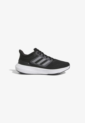 Scarpe da ginnastica nere con una tomaia in maglia testurizzata, tre strisce grigie e una suola intermedia bianca. Presentano un collo imbottito e una chiusura con lacci.
