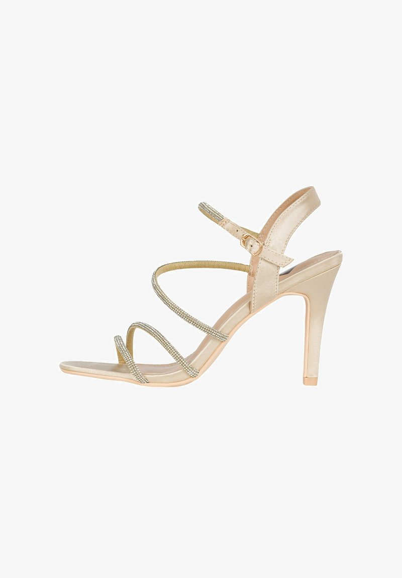Sandali beige con tacco alto e cinturini incrociati. I cinturini presentano un dettaglio di strass argentati lucidi. Superficie liscia e design con punta appuntita.