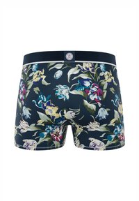 Boxers en coton bleu marine foncé avec un motif floral coloré comportant des fleurs jaunes, rouges, bleues et blanches, et une taille noire unie avec un patch logo.