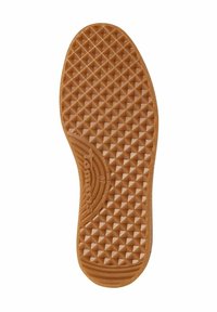 Semelle de chaussure en caoutchouc de couleur tan avec un motif en diamant texturé pour l'adhérence, avec un bout arrondi et une marque en relief le long du bord.