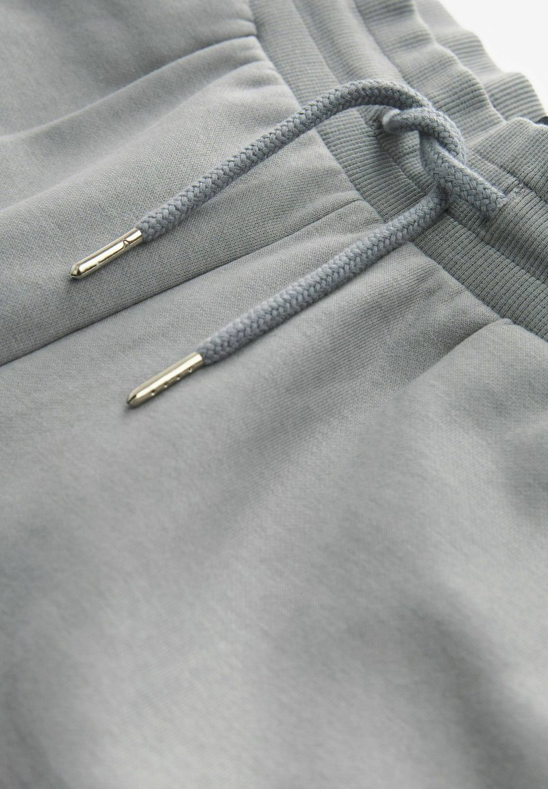 New Balance Pantaloni da jogging Sport Essentials Fleece Jogger uomo grigio online | Italia