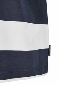 Navy blue and white striped cotton T-shirt, round neckline with stitching detail, featuring a small brand label at the hem.