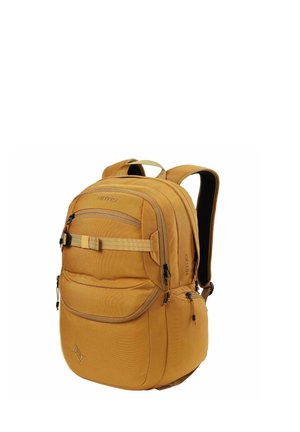 Sac à dos Nitro jaune-brun avec plusieurs compartiments zippés, bretelles rembourrées et une sangle avant pour sécuriser les objets.