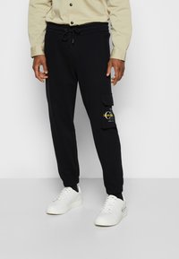 Calvin Klein Jeans TWO TONE MONOGRAM PANT - Pantaloni sportivi - black