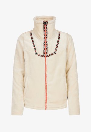 Veste en polaire couleur crème avec un col haut, une fermeture éclair à l'avant et des accents en motifs géométriques noirs et rouges le long de la poitrine et de la fermeture éclair.