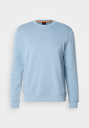 Felpa azzurra chiara con colletto rotondo, polsini e orlo a costine. Presenta un piccolo logo impresso sul petto. Tessuto morbido al tatto.