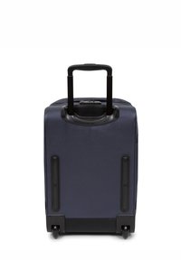 Maleta de cabina azul marino con tejido texturizado, asa retráctil, ruedas resistentes y esquinas reforzadas para mayor durabilidad. Diseño compacto para viajar.