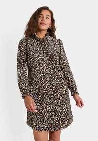 Vestido de estampado de leopardo con cuello tipo camisa, cierre delantero con botones, mangas largas con puños acampanados y un dobladillo ligeramente acampanado.