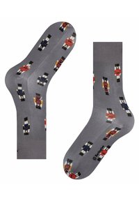 Calze grigie con un design colorato di soldatini. Texture liscia con punta e tallone rinforzati. Adatte per un abbigliamento casual.