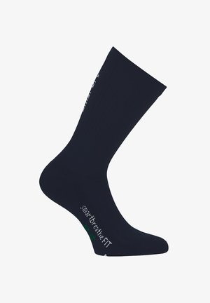 Dunkelblaue Socke aus geripptem Stoff. Verfügt über kontrastierenden Text und Logo in der Nähe des Knöchels, das eine eng anliegende, taillierte Passform betont.