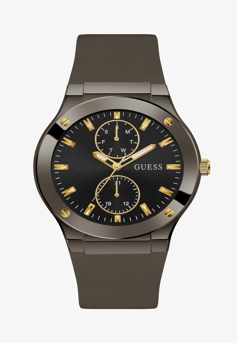 Zegarek z czarną tarczą i złotymi akcentami, wyposażony w trzy sub-tarcze, wyraźne znaczniki godzin oraz matowy, szary pasek z silikonu. Metalowa koperta i korona.