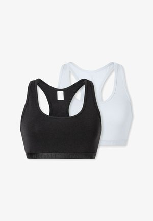 Deux brassières de sport : une noire et une bleu clair. Les deux présentent un col en scoop, un design dos nageur et une bande élastique avec un branding subtil.
