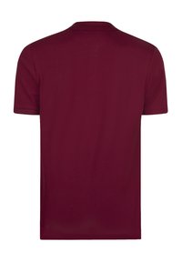 Bordeaux polo skjorte med korte ærmer, lavet af blød bomuld. Har en klassisk krave og en glat, jævn tekstur.