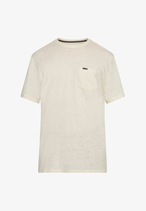 Vaaleanbeige lyhytnenäinen t-paita, joka on valmistettu kevyestä kankaasta. Paidassa on rintatasku ja hienovarainen tekstuuri.